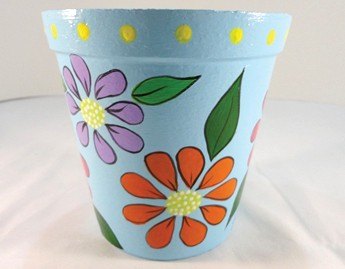 Vaso Azul Floral pronto — vista frontal com flores coloridas e fundo azul