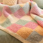 Trocador Colorido de Tricô: Manta Patchwork para o Bebê